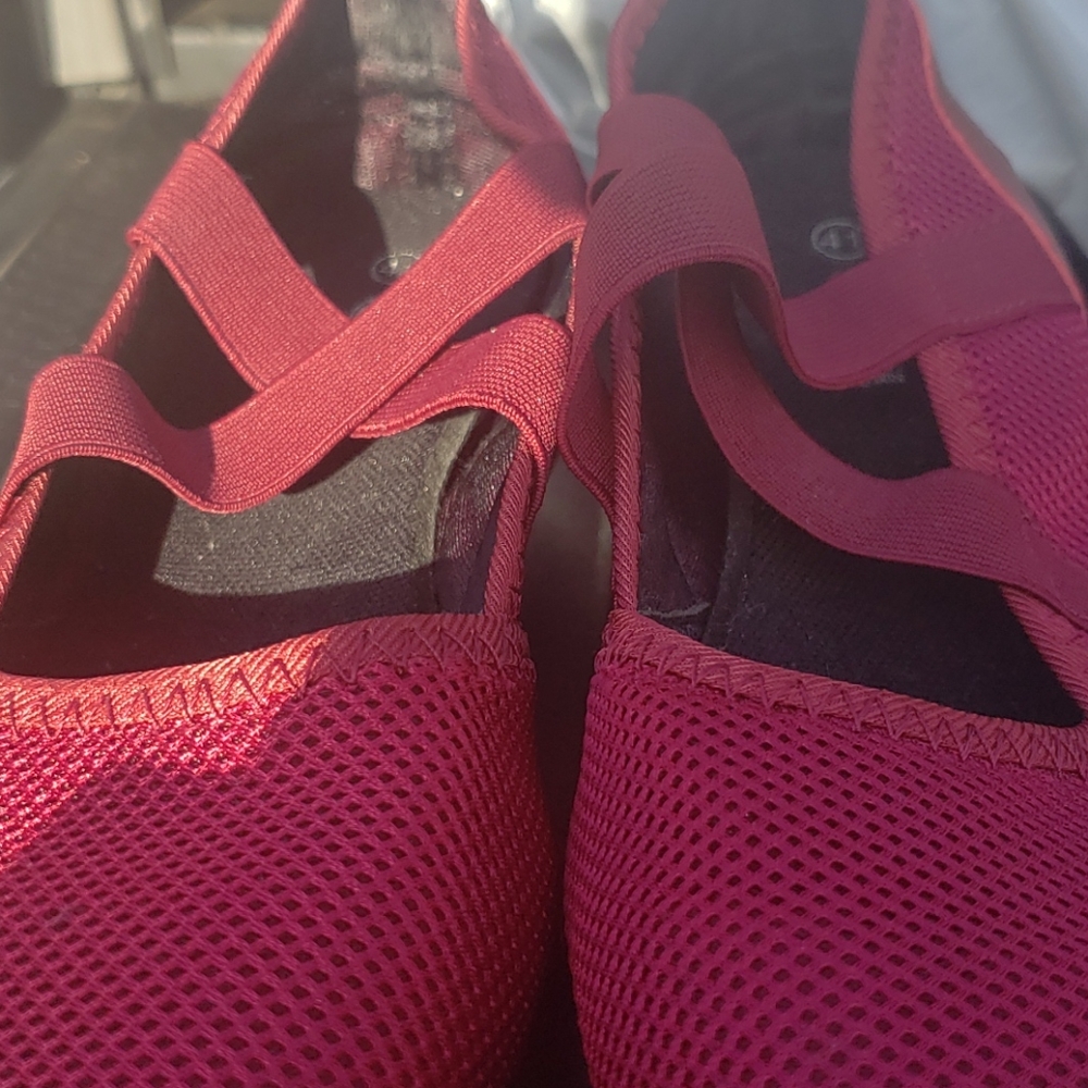 A pair of burgundy shoes